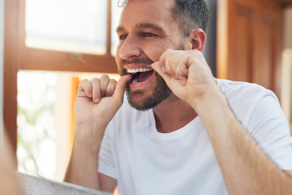A Complete Guide to Flossing Teeth - Paramount Dental Arts